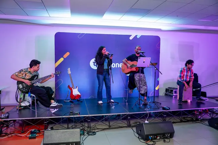 Live band performing on a purple-lit stage