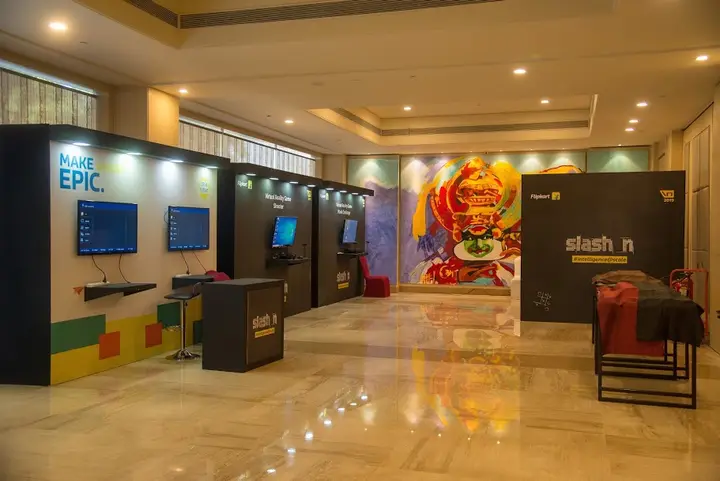 Exhibition booths and a “Make Epic” wall at a Flipkart Slash N venue