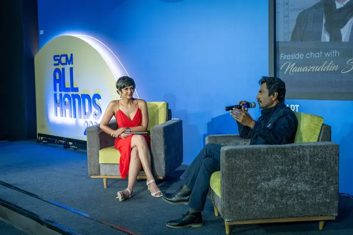 Fireside chat on stage at an SCM All Hands event