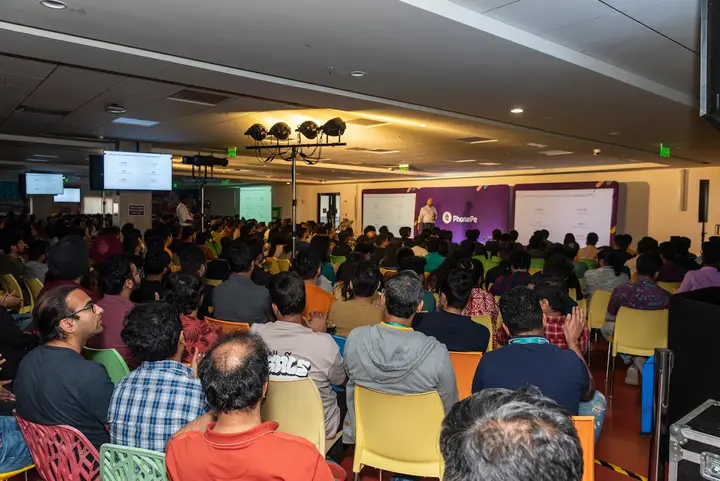 Packed audience at a large PhonePe company event