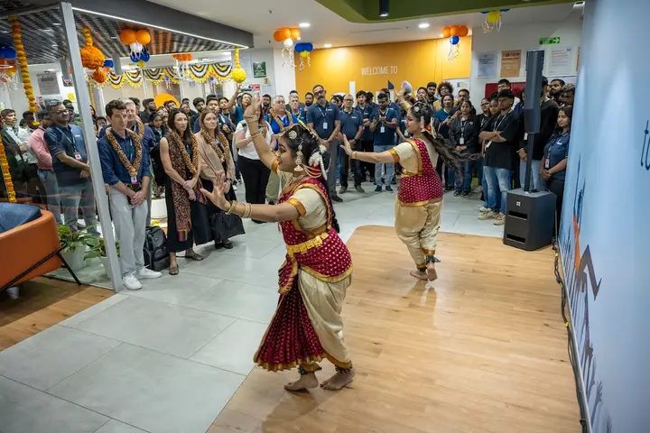 Classical dancers performing at an office celebration